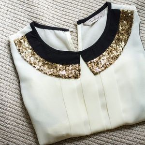Sleeveless blouse with sequin collar